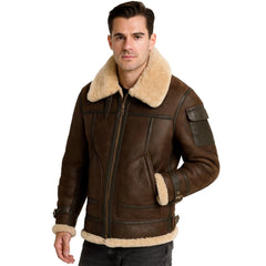 A man wearing a brown leather aviator-style jacket with a thick beige shearling collar and lining, photographed against a plain white background.